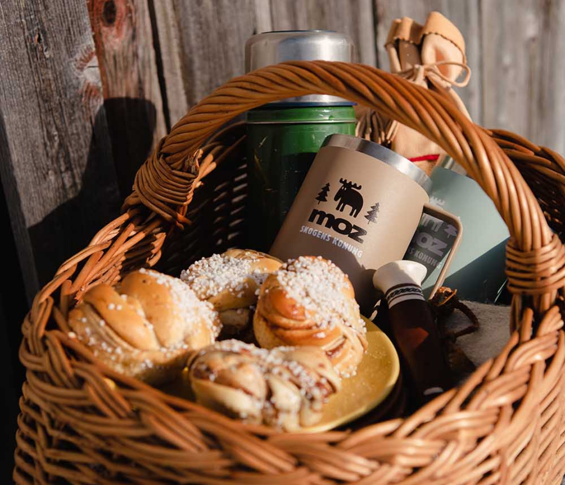 A basket of fika, coffee and cinnamon buns