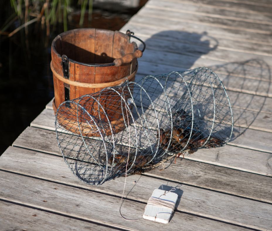 Wooden bucket and trap for crayfishing.