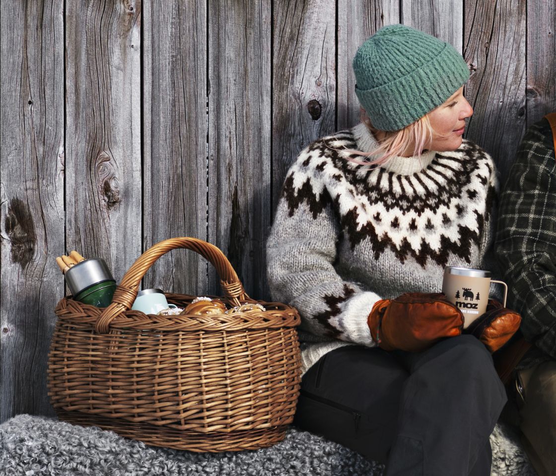 Woman having picnic out doors in winter