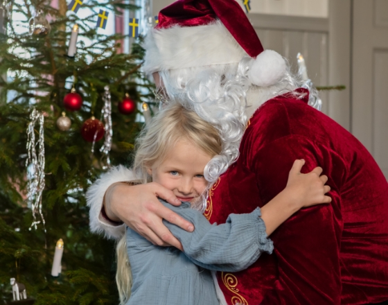 Girl hugging santa