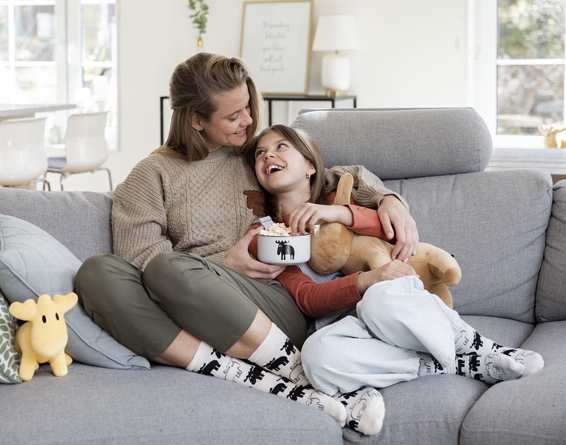 Mother and daughter eating popcorn