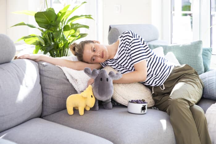 a lady is on the sofa