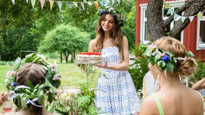 Woman serving strawberry cake